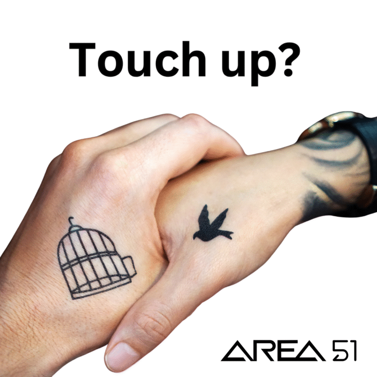 Tattoo touch up? Image shows two tattoo'd hands holding. Area 51 logo is present.